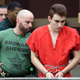 Nikolas Cruz is escorted into the courtroom for his arraignment at the Broward County Courthouse on March 14, 2018, in Fort Lauderdale, Fla. Cruz is accused of opening fire at Marjory Stoneman Douglas High School in Parkland, Fla., on Feb. 14, killing 17 students and adults.